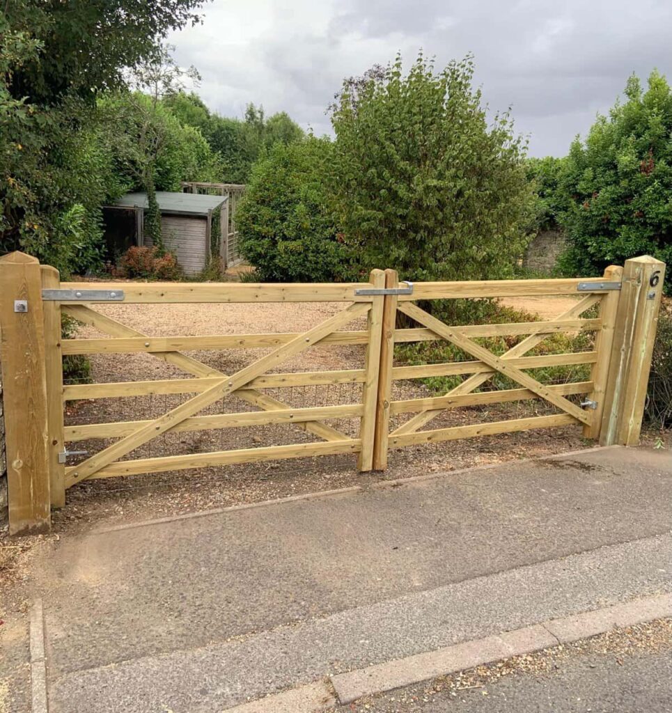 This is a photo of a wooden driveway gate installed by Fast Fix Fencing Toftwood